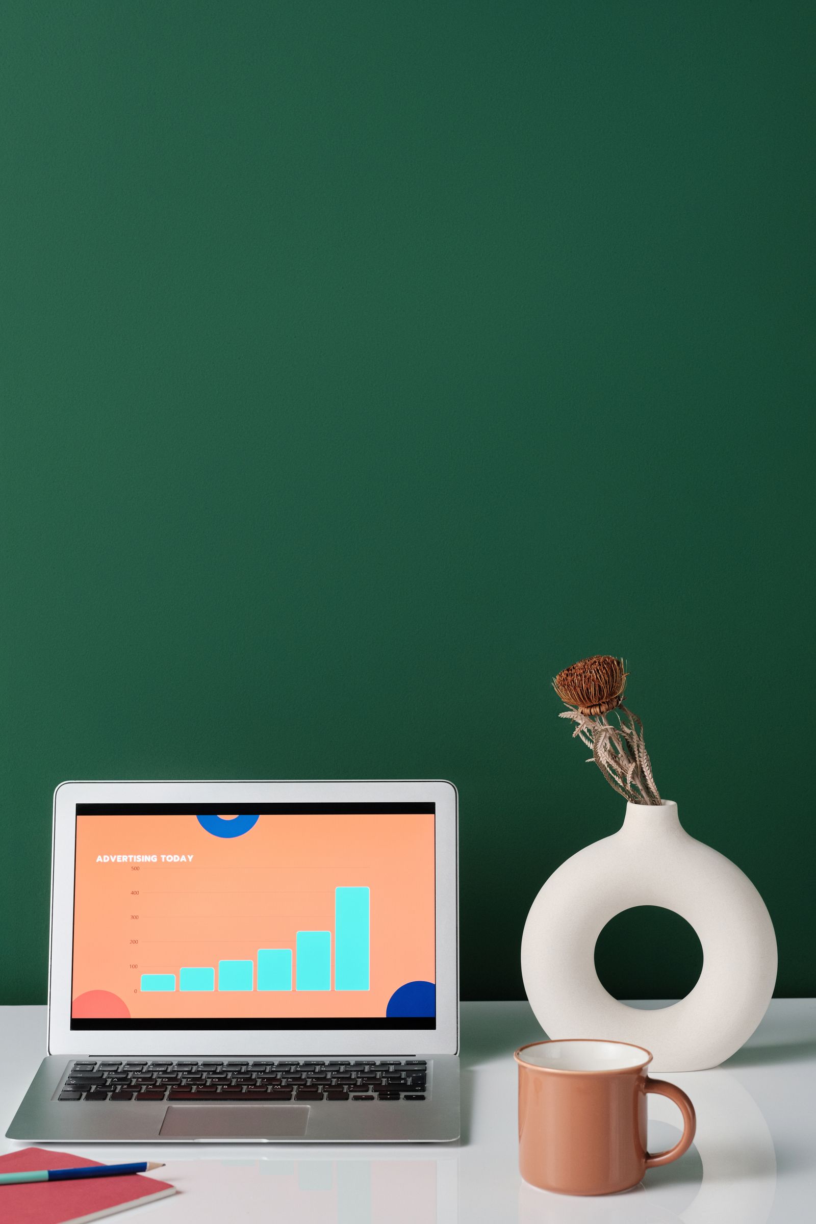 Laptop displaying business charts on a quiet, organized desk